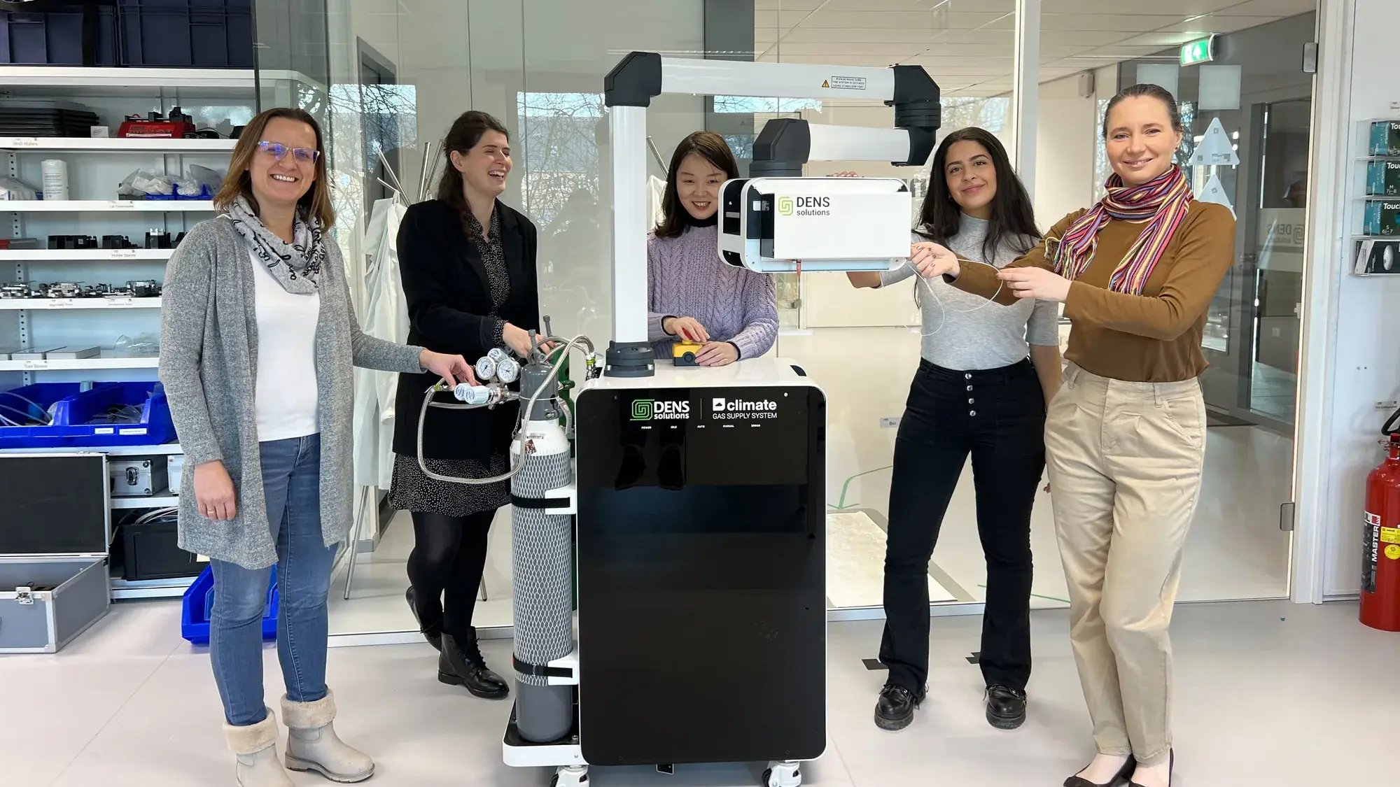 DENSsolutions colleagues with a Climate gas supply system at the Delft office